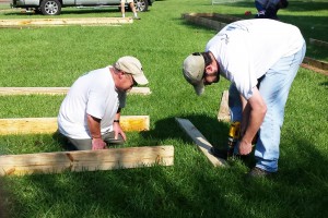 Neighbors Randy Macon and Sam Martin assembled the raised bed frames.